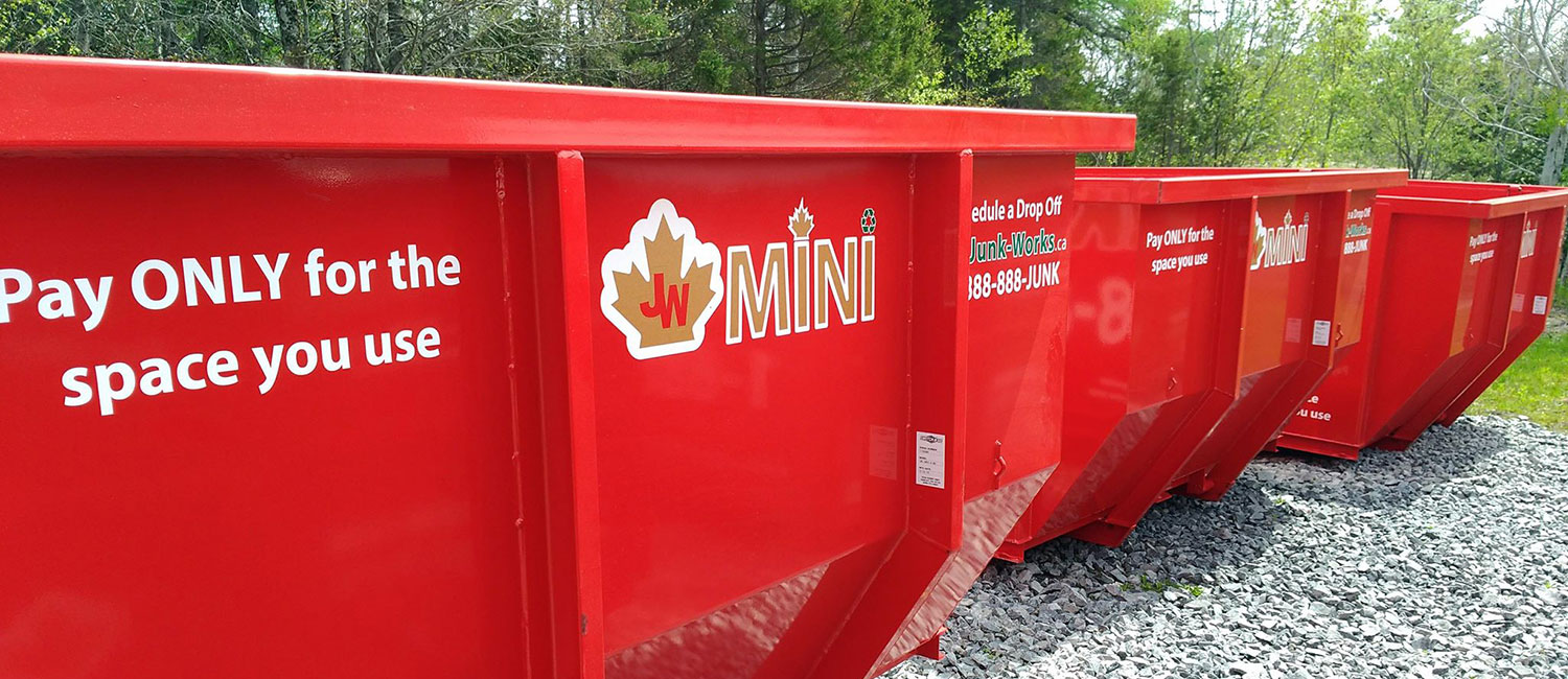 3 red mini dumpsters